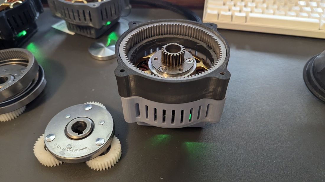 Planetary actuator iteration with a steel ring gear and nylon planet gears inside a 3D-printed housing.